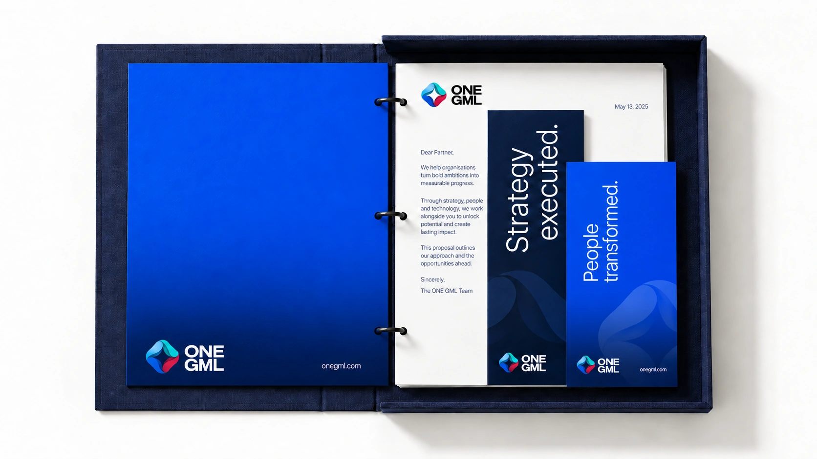 A navy ONE GML executive folio with a cobalt divider and presentation materials.
