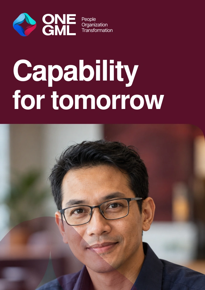 Capability for tomorrow. The approved portrait with glasses, a rounded upper-right photo corner and a translucent ONE GML watermark.